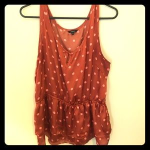Rust colored silky tank with double peplum detail